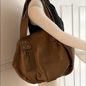 Leather satchel by “Sorial” light lining inside, brass studs, gorgeous bag!